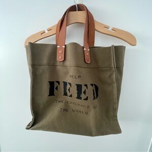 Feed the children tote bag